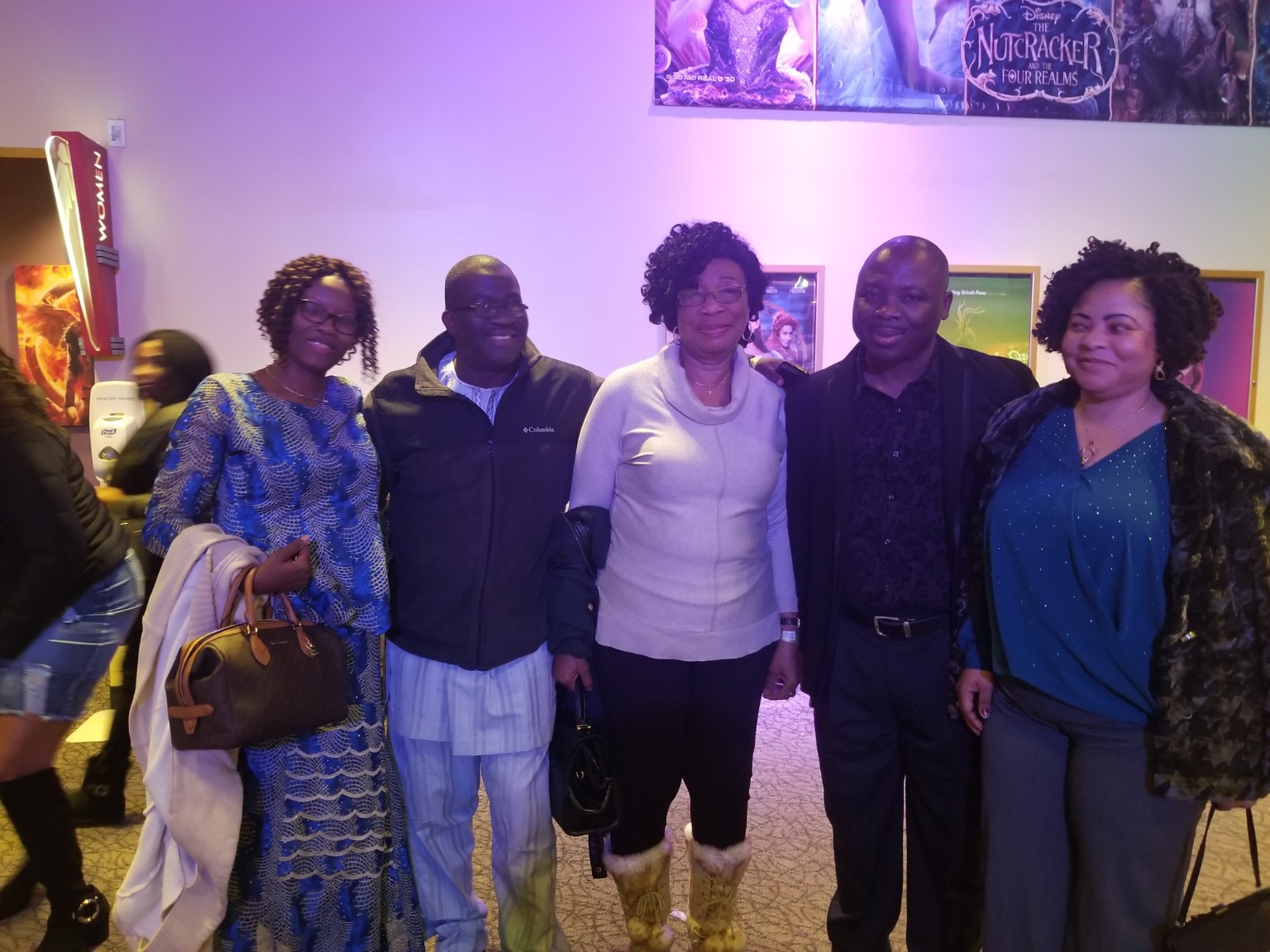 A group of premiere attendees gathered inside the theater