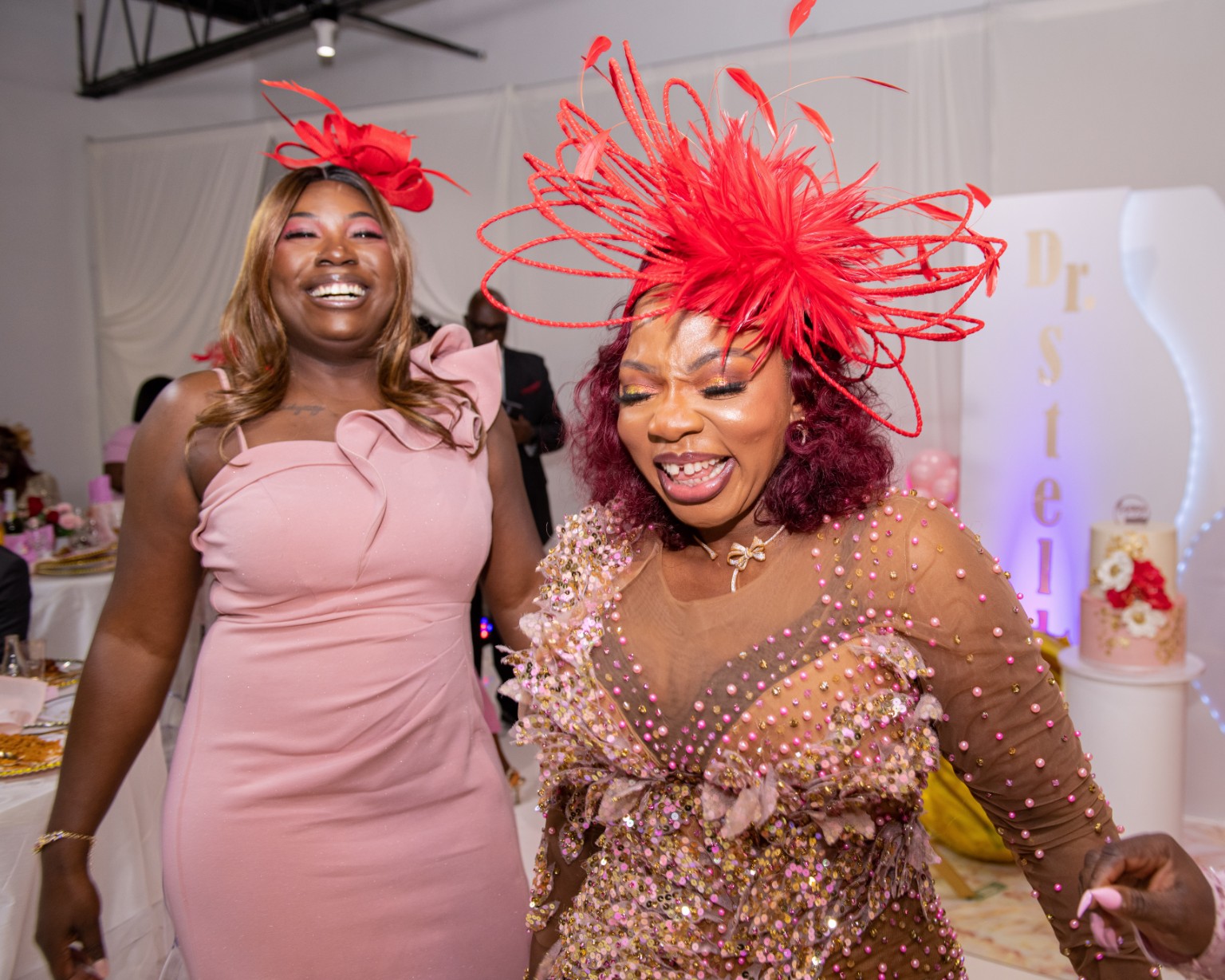 Celebrant sharing a joyful moment with a guest during her surprise 45th birthday celebration